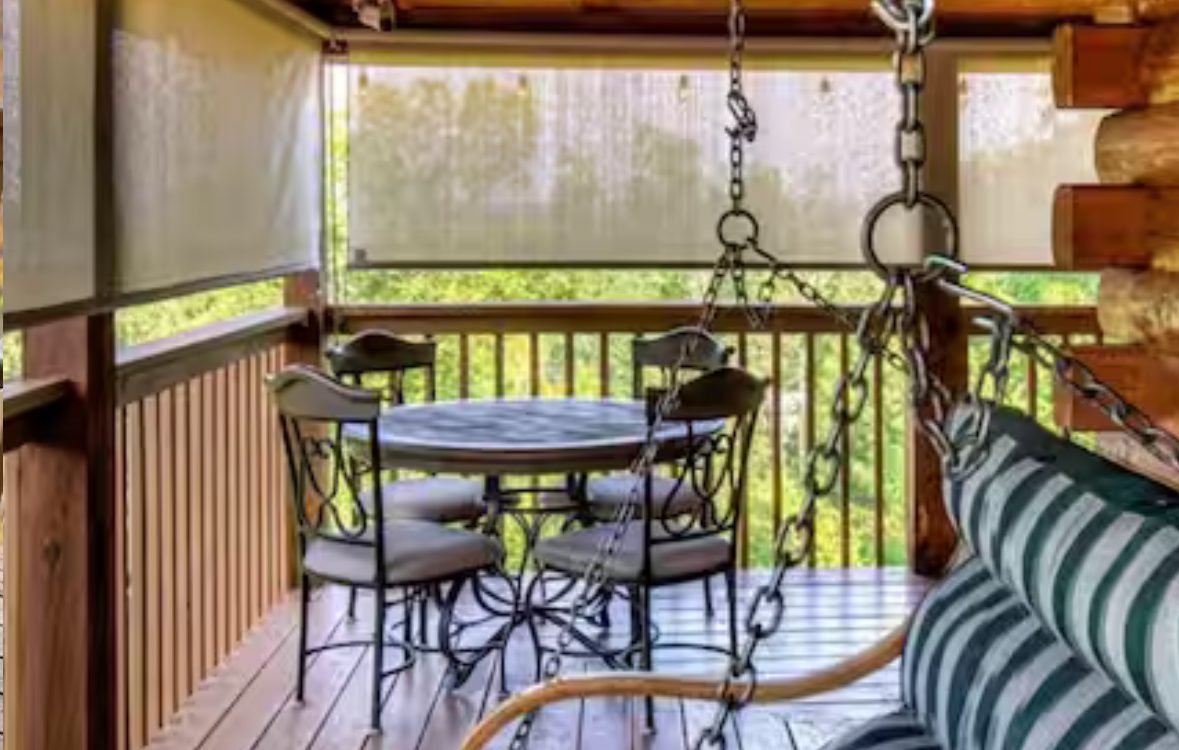 Rocking chairs on the covered porch beside the hot tub